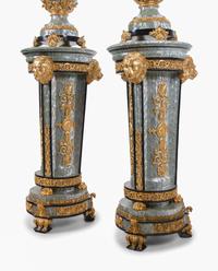 A Pair of Neoclassical Style Gilt Composite and Abalone Veneered Urns and Pedestals