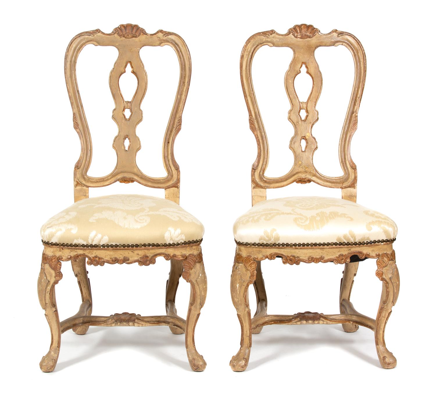 A Set of Twelve Italian Rococo Style Painted Dining Chairs Height 42 1/2 inches. — 19TH CENTURY