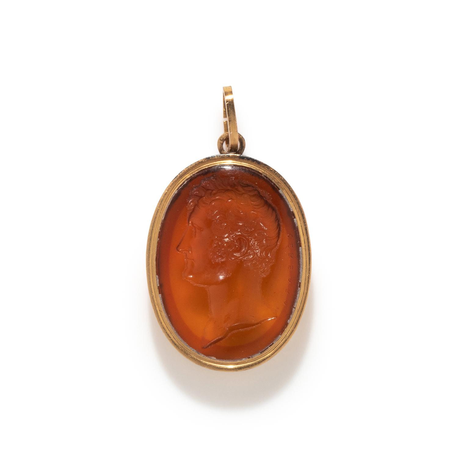 A Victorian Gold and Glass Pendant with a Male Portrait Bust