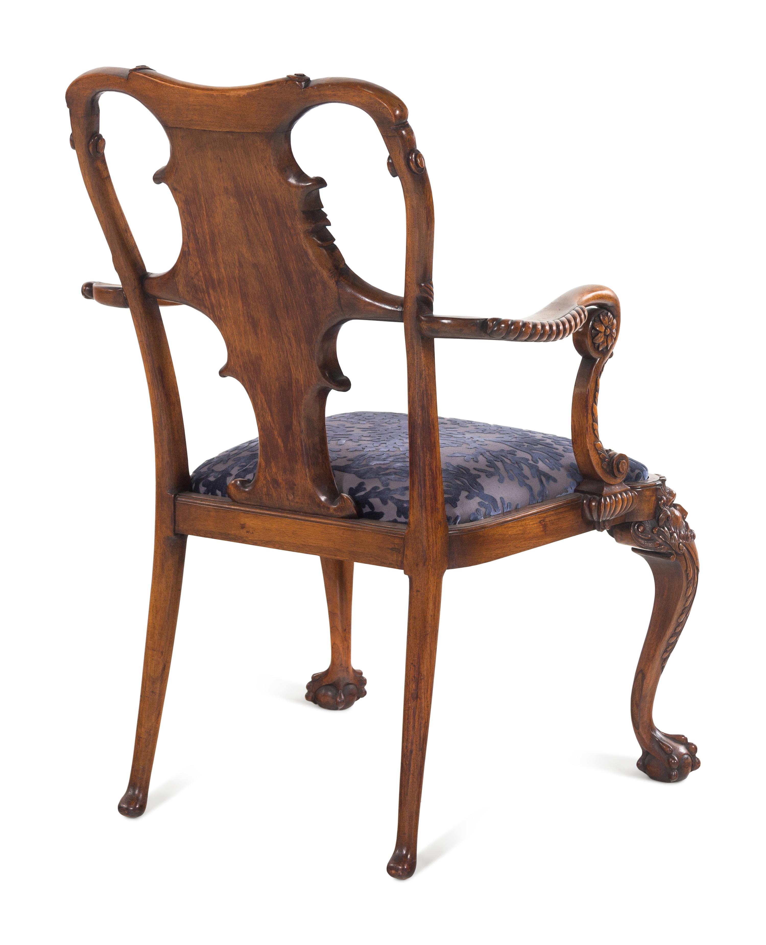An Irish George I Style Carved Walnut Armchair