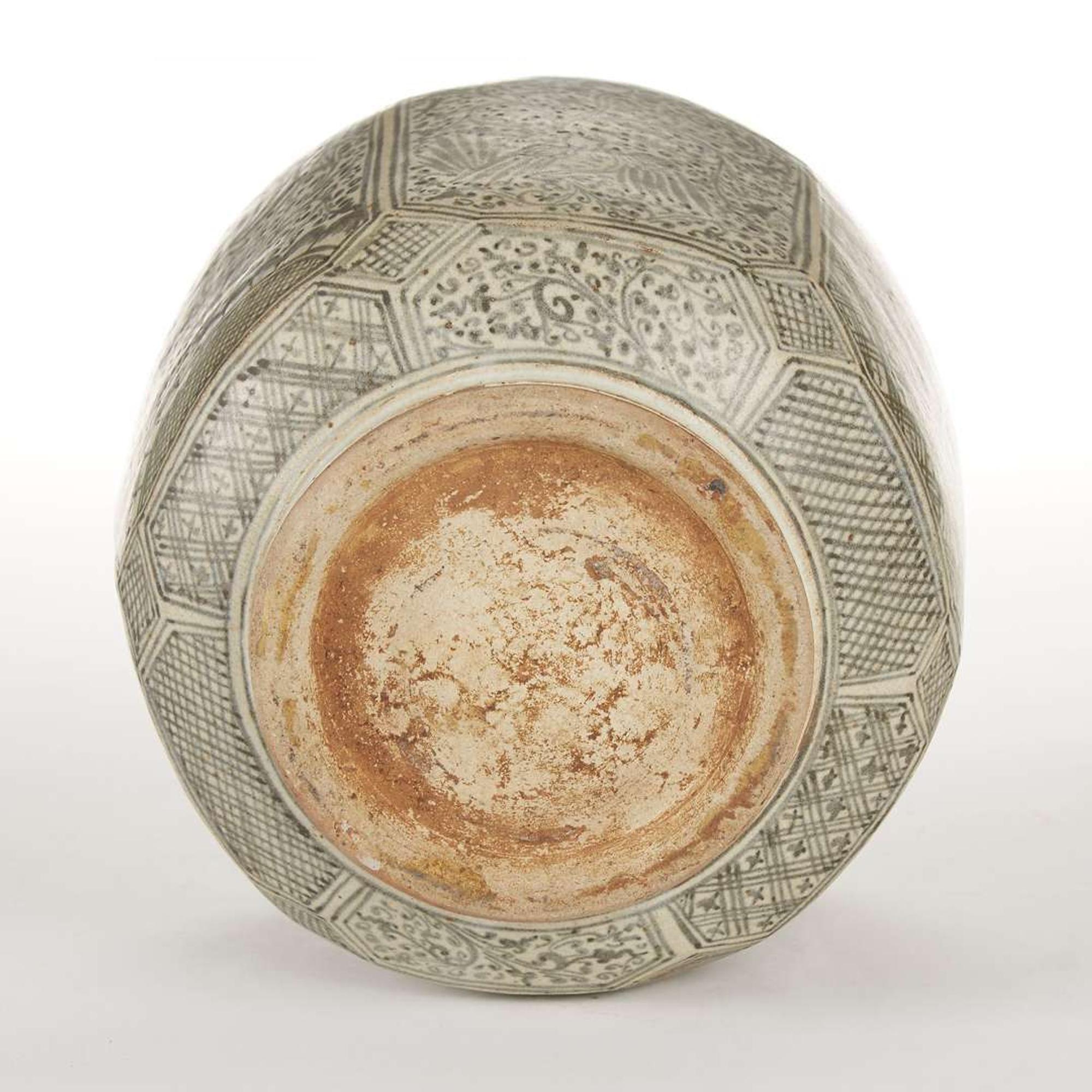 A large Thai underglaze blue-decorated stoneware faceted jar and cover. possibly 14th-16th century