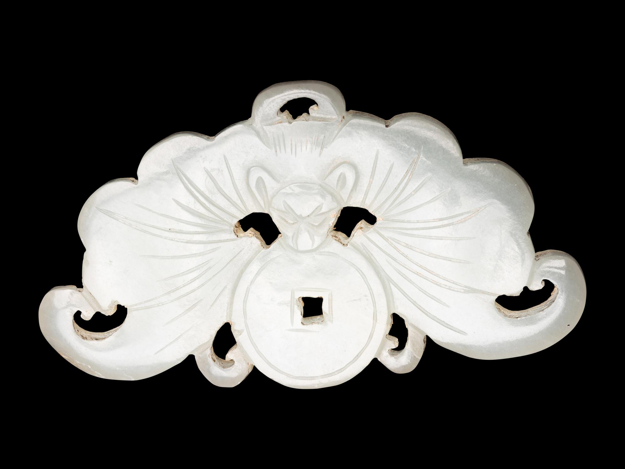 Three Chinese Pale Celadon Jade Reticulated Flori-Form Pendants