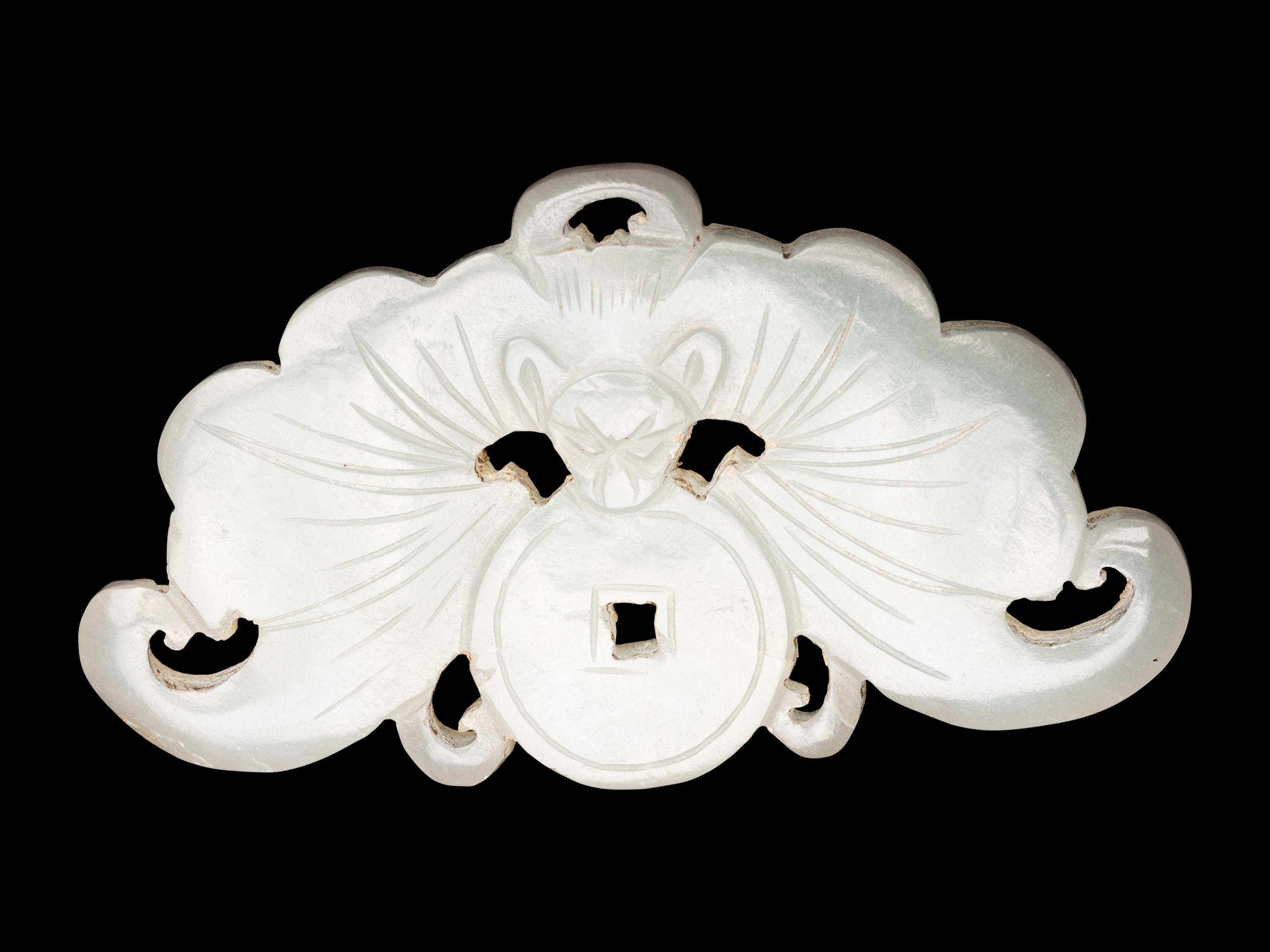 Three Chinese Pale Celadon Jade Reticulated Flori-Form Pendants