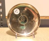 An English Silver Dish, Roberts & Dore, London, 1966, with an upturned rim, centered by a Winston Churchill silver coin.