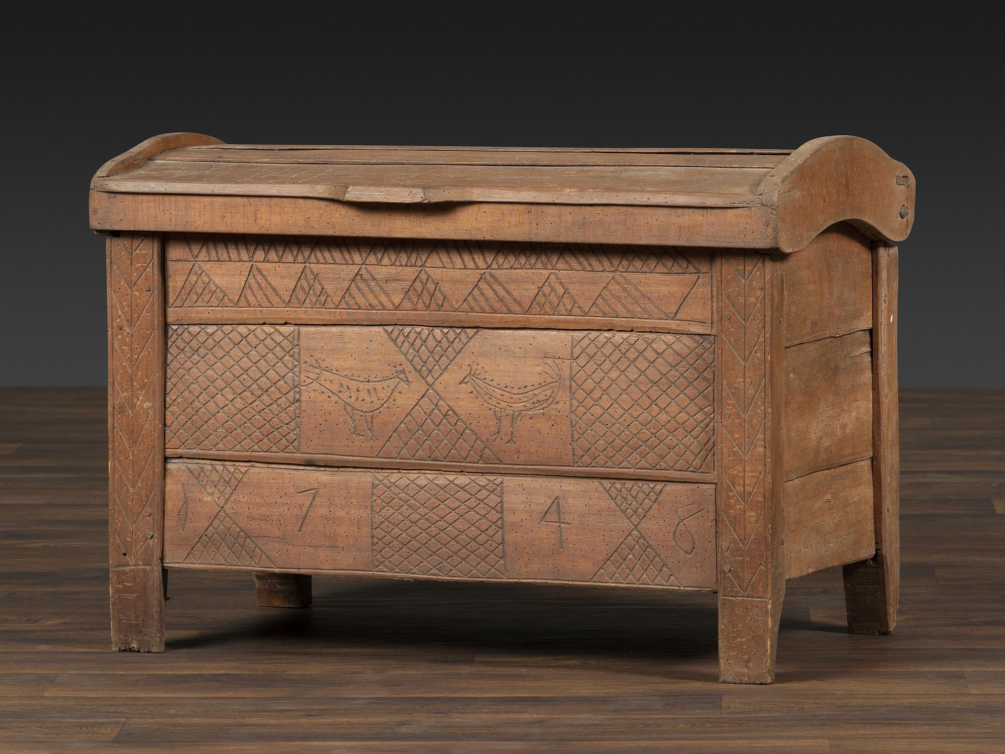 A Continental Chip and Bird Carved Dome-Top Blanket Chest