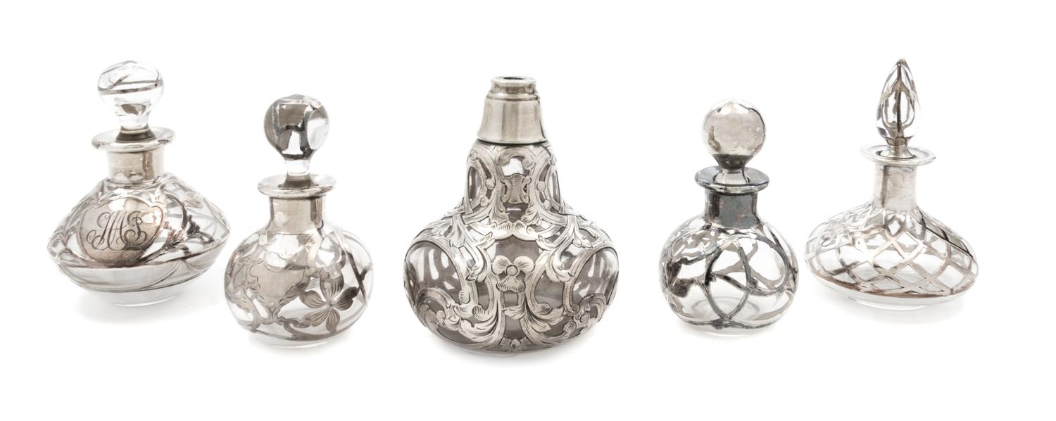 A Group of Five Silver Overlay Glass Bottles Height of tallest 4 1/4 inches.