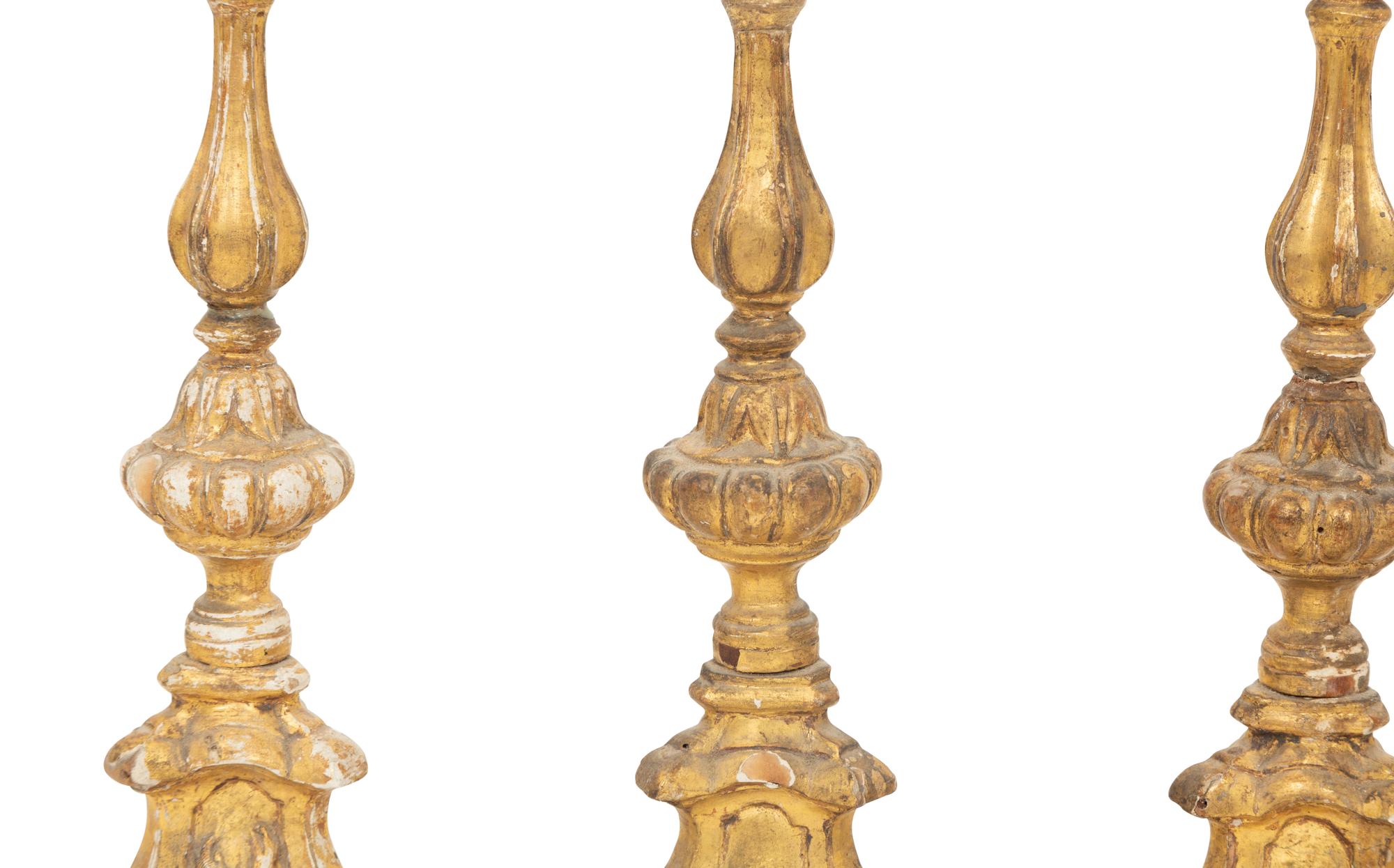 A Set of Four Italian Giltwood Candlesticks