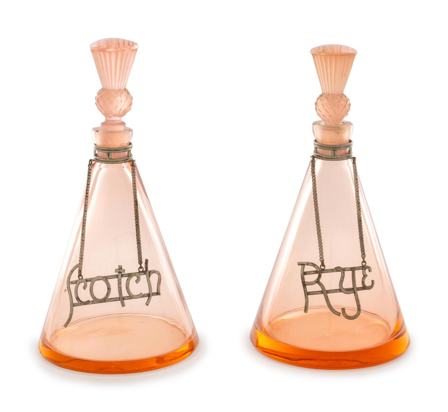 A Pair of Silvered Metal Mounted Glass Liqueur Bottles