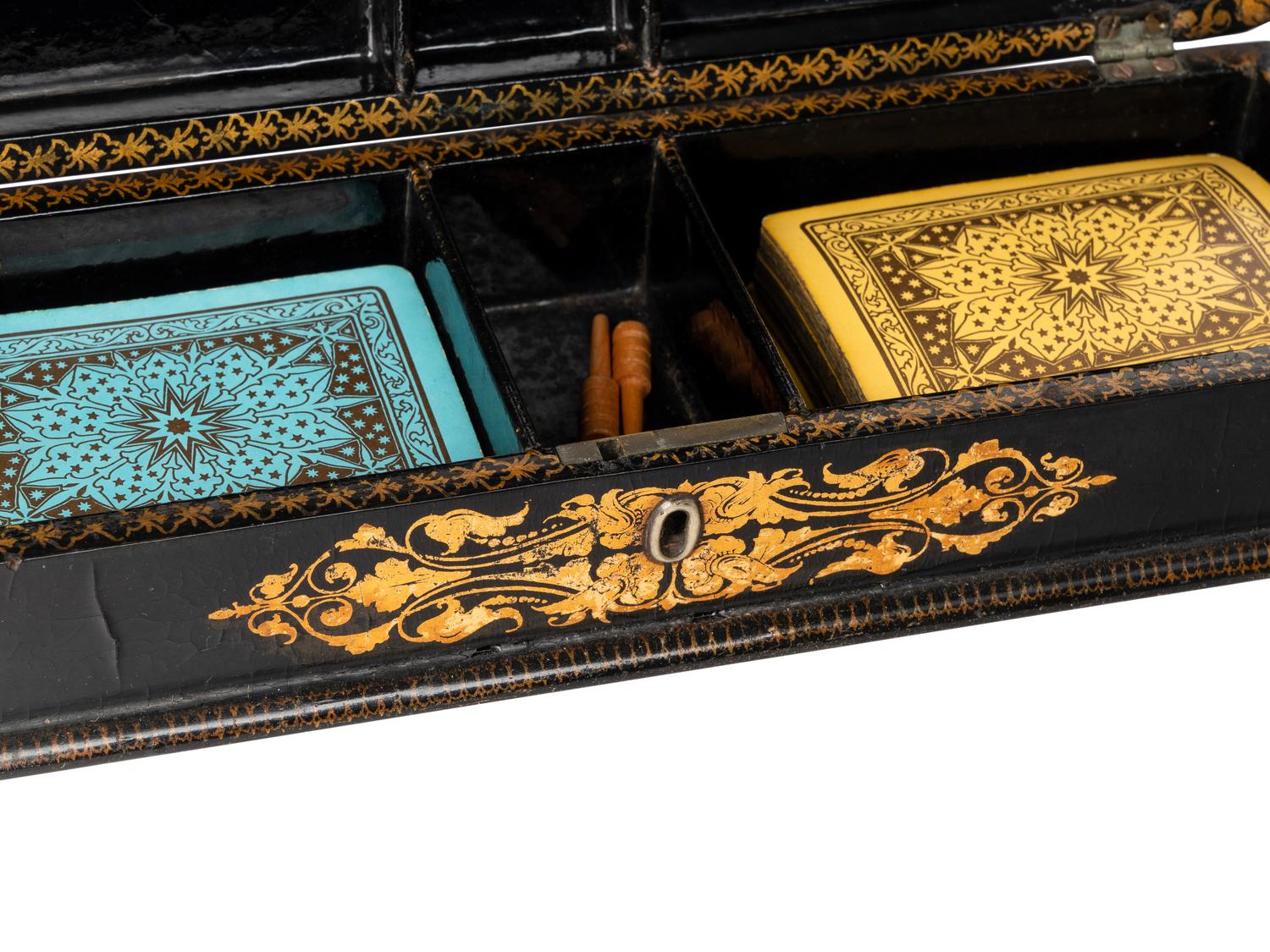 A Victorian Mother of Pearl-Inset and Parcel-Gilt Papier-Mache Cribbage Box