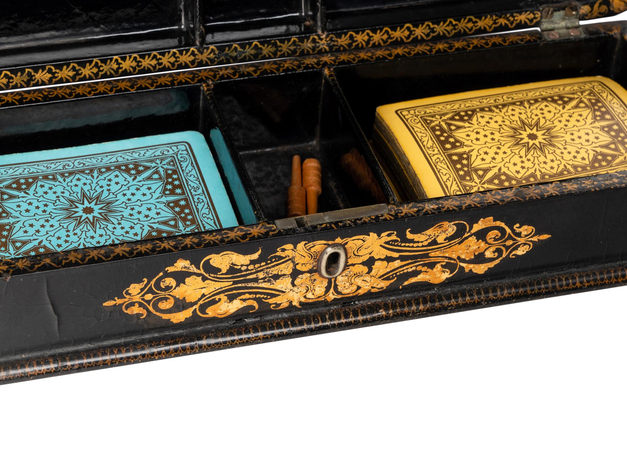 A Victorian Mother of Pearl-Inset and Parcel-Gilt Papier-Mache Cribbage Box