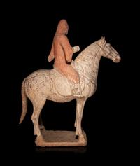 A Pair of Painted Pottery Equestrian Figures