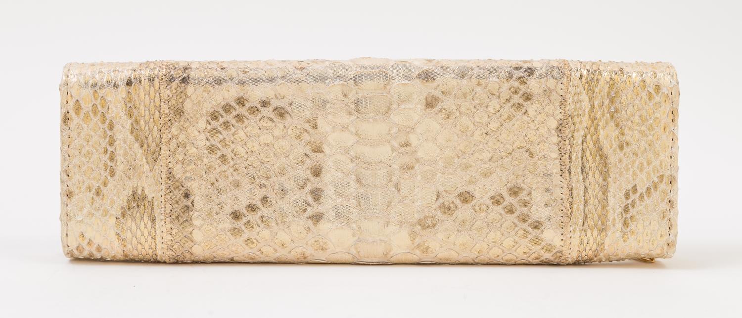 A Carlos Falchi Gold Snakeskin Clutch, 10" x 3.5" x 1".