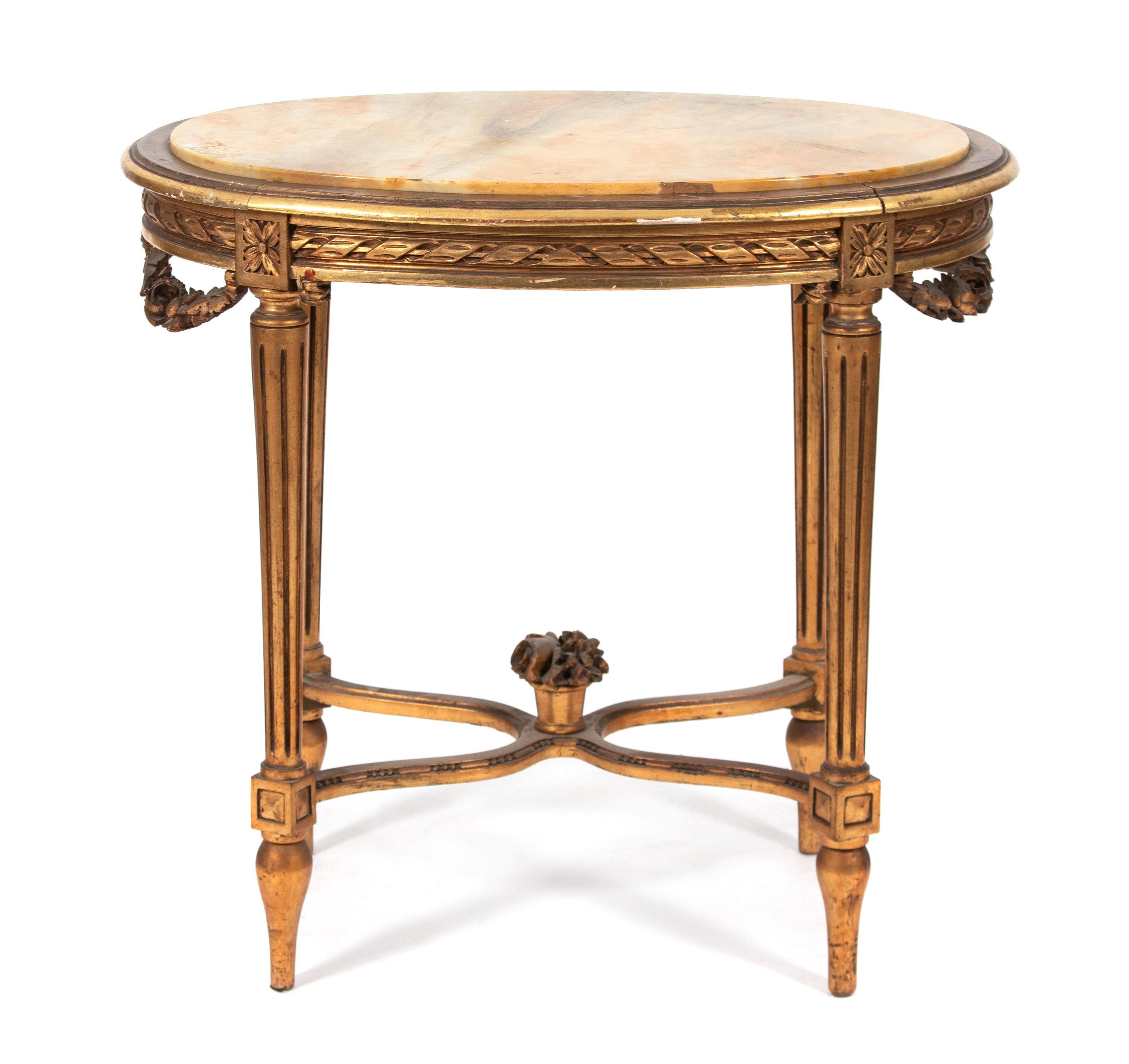 A Louis XVI Style Giltwood and Marble Top Oval Table