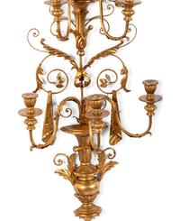 A Pair of Rococo Style Five Light Giltwood and Gilt Metal Wall Sconces