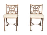 A Pair of Patinated Metal Garden Chairs and Side Table