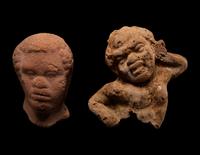 A Nubian Terracotta Head and Reclining Figure
