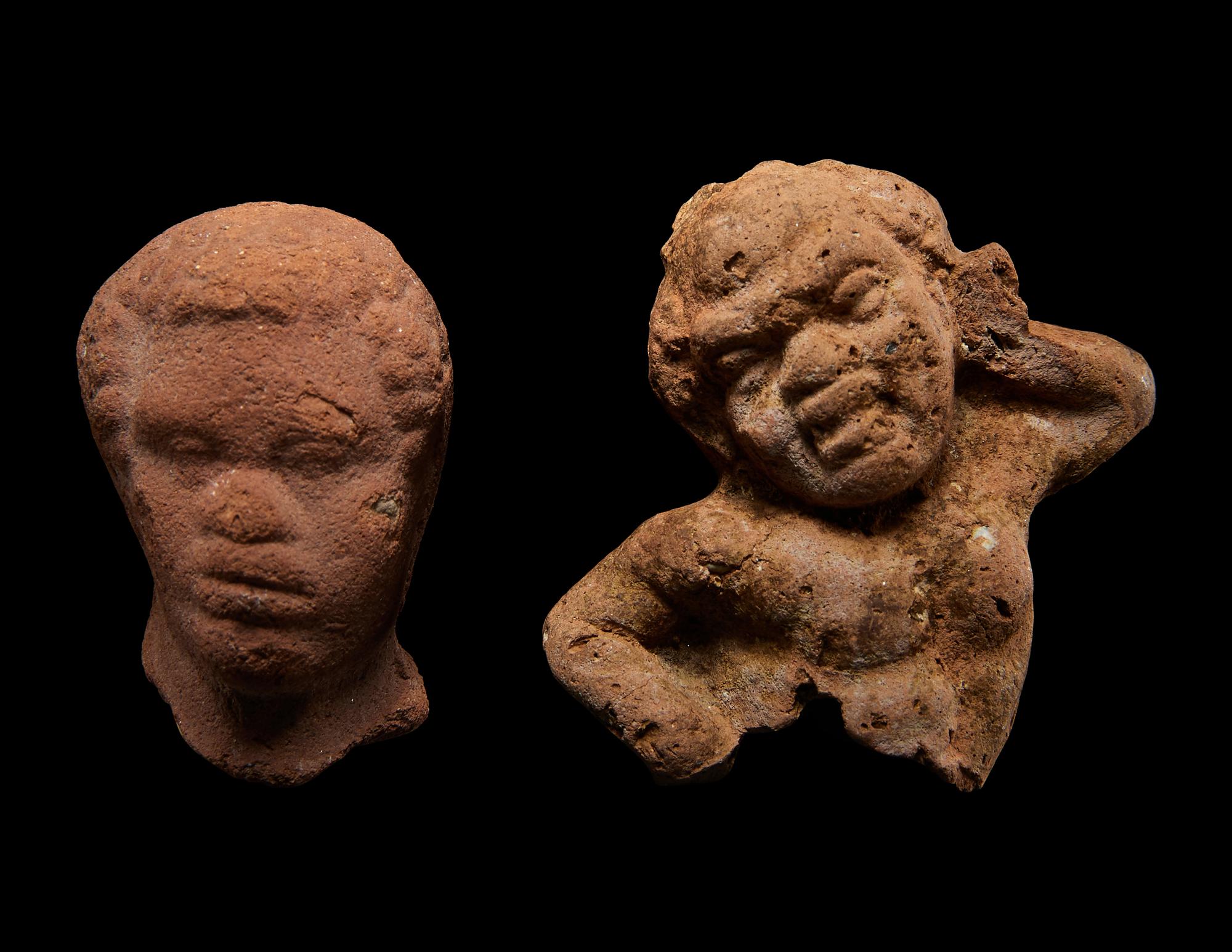 A Nubian Terracotta Head and Reclining Figure
