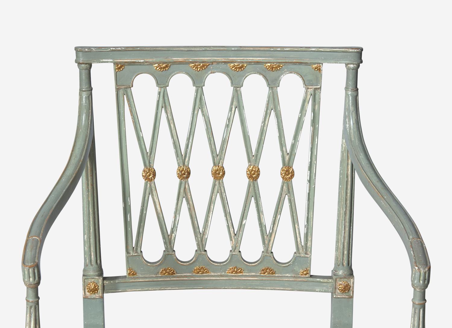 A Set of Ten George III Green and White Painted and Parcel Gilt Lattice Back Dining Chairs
