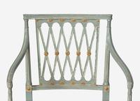 A Set of Ten George III Green and White Painted and Parcel Gilt Lattice Back Dining Chairs