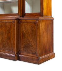 A Late George III Pierce Carved and Figured Mahogany Breakfront Cabinet