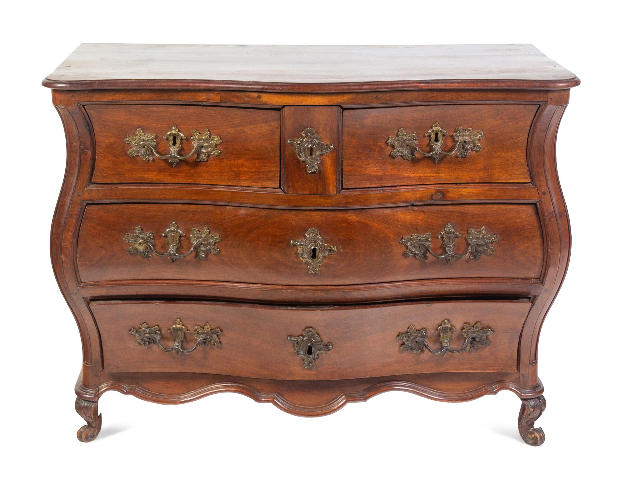 A Louis XV Provincial Walnut Bombé Commode