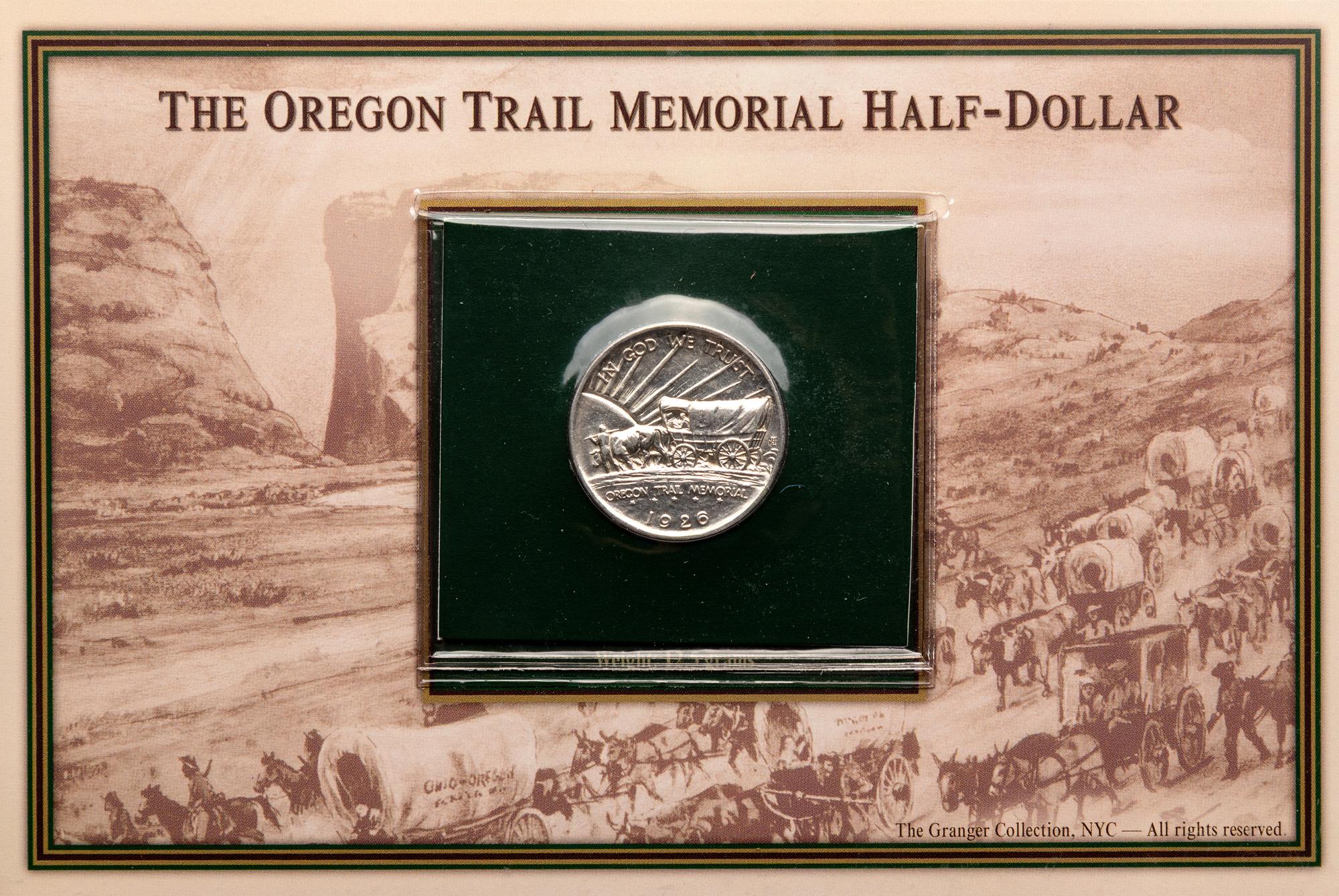 A Group of Four Commemorative 50c Coin and Stamp Sets