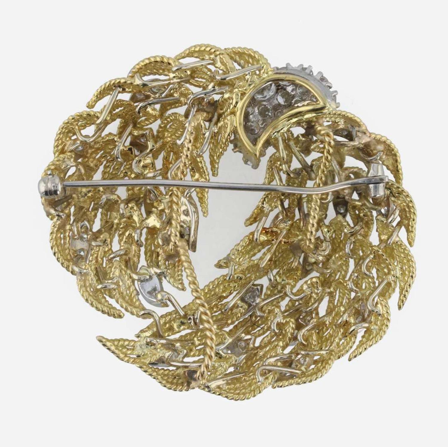 An 18K, bicolor diamond brooch