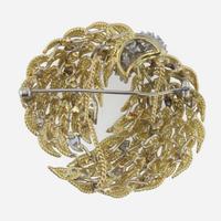 An 18K, bicolor diamond brooch