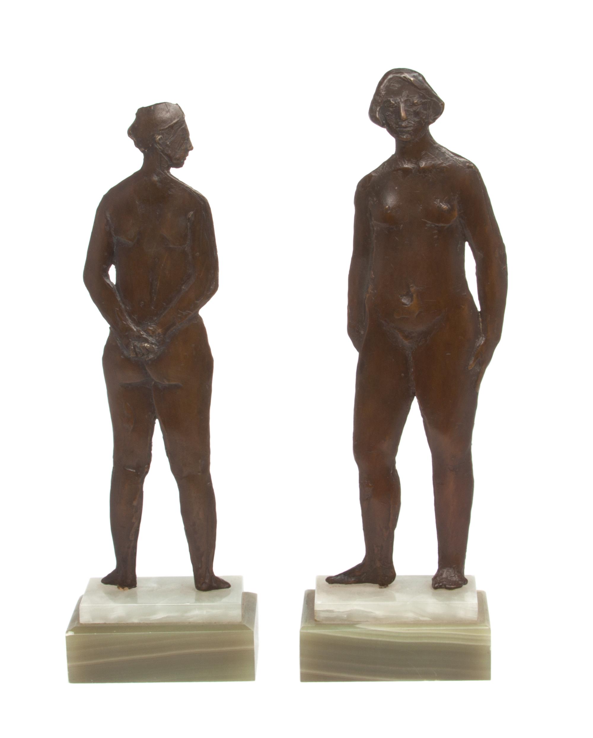 A Pair of Patinated Metal Figural Bookends Height 11 inches.