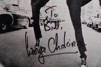 (Celebrity) A group of 16 autographed celebrity photos, comprising:
