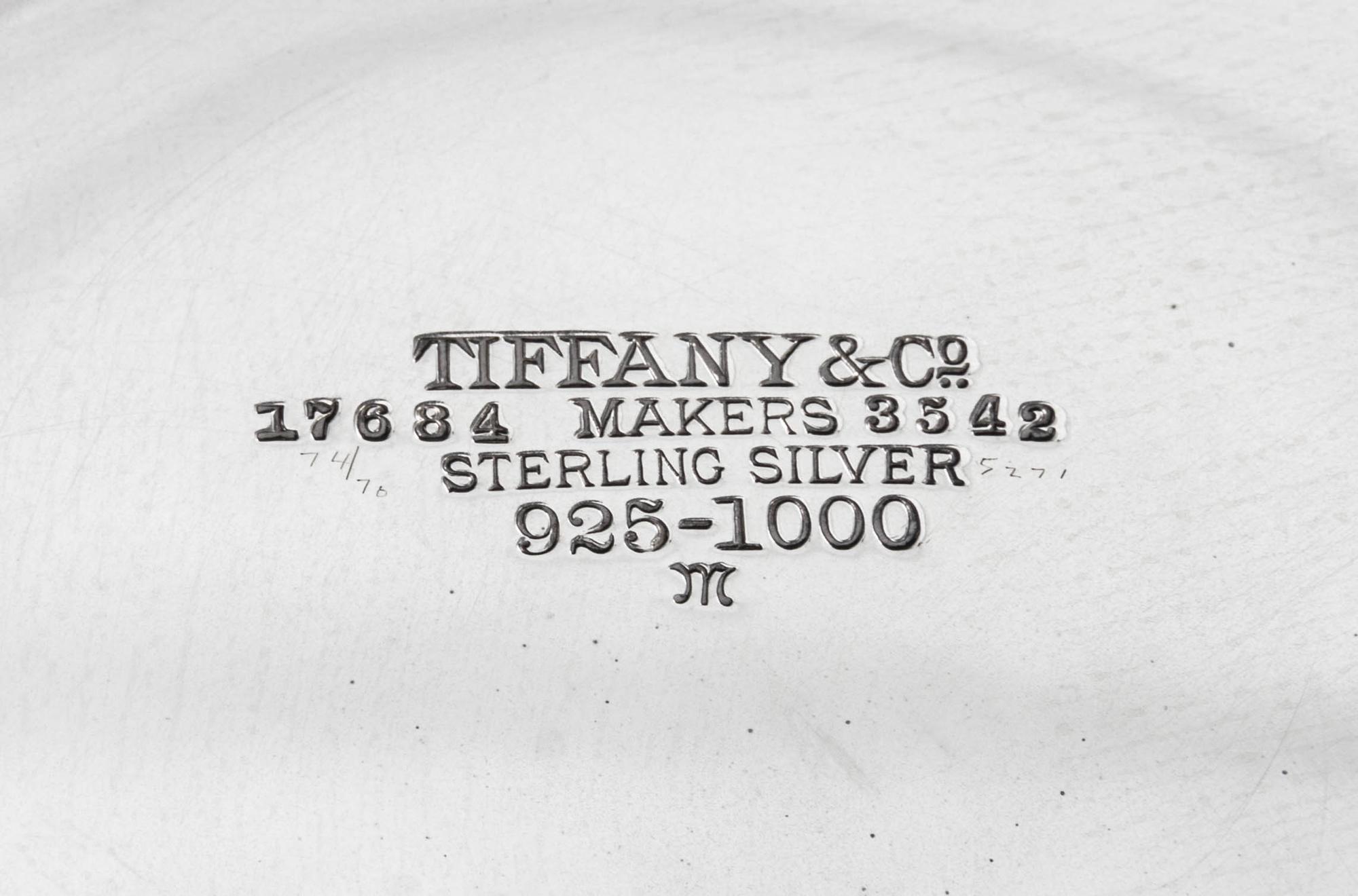 An American Silver Centerpiece Bowl, Tiffany & Co., New York, NY, 1910, circular, with turned-over border pierced and engraved with scr