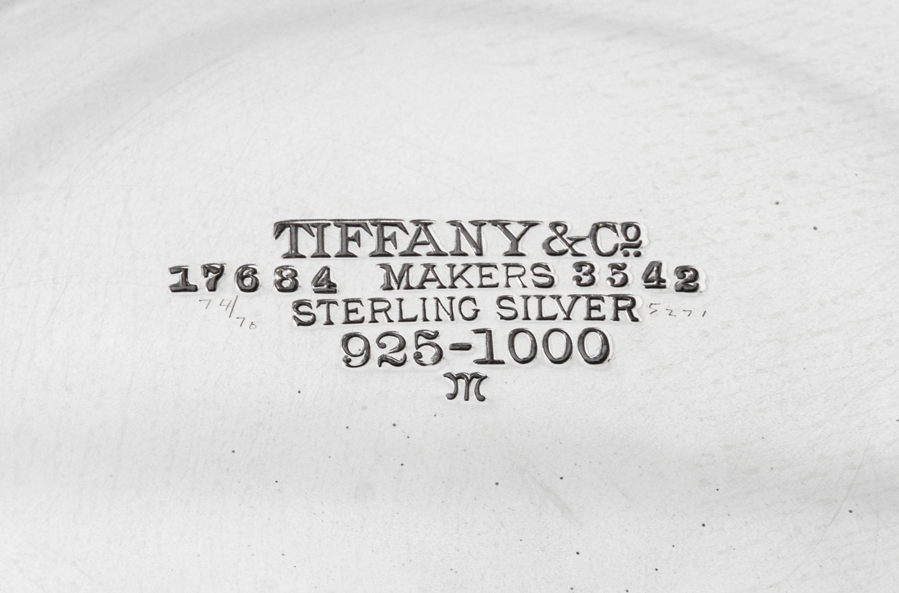An American Silver Centerpiece Bowl, Tiffany & Co., New York, NY, 1910, circular, with turned-over border pierced and engraved with scr