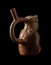 A Moche Stirrup Vessel in the Form of a Shaman with Feline Headdress