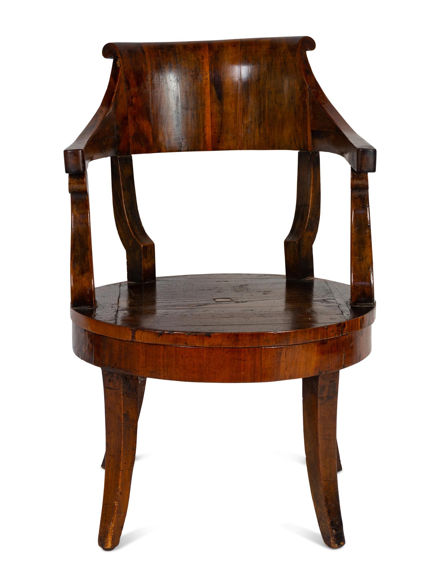 A Continental Barrel-Back Armchair