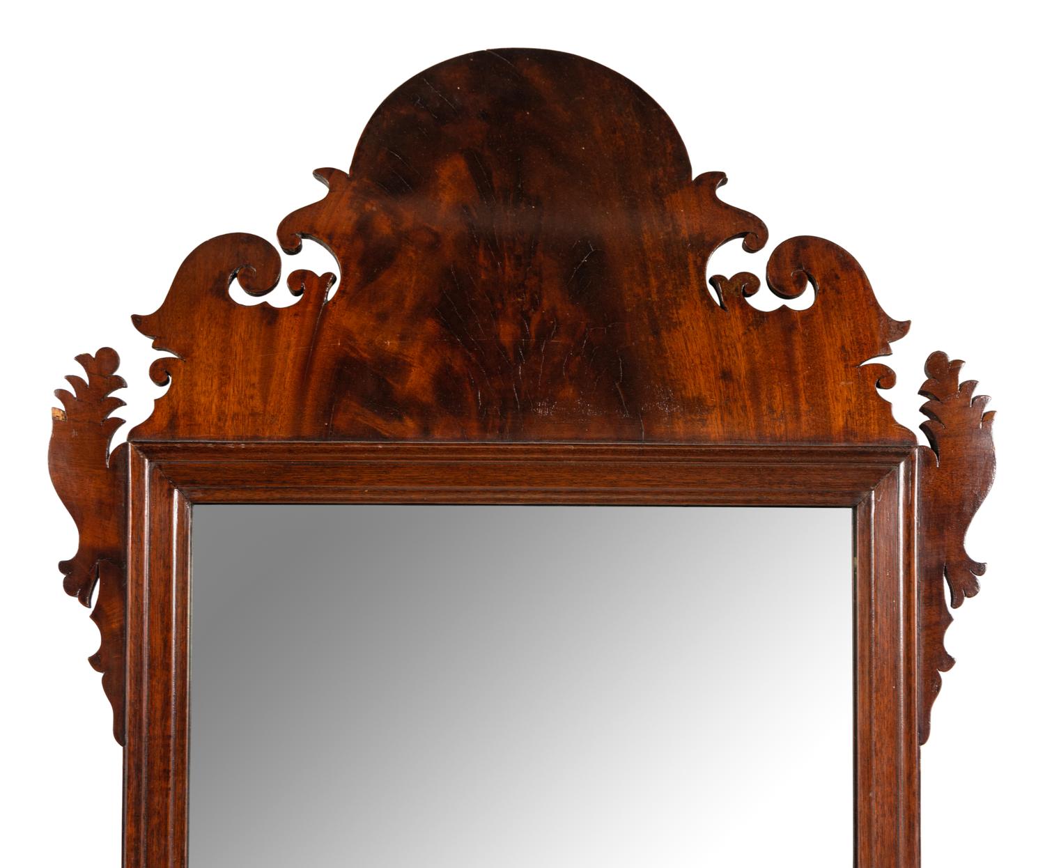 A Chippendale Carved and Figured Walnut Looking Glass