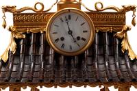A Continental Gilt Bronze and Celadon Porcelain Figural Chinoiserie Clock