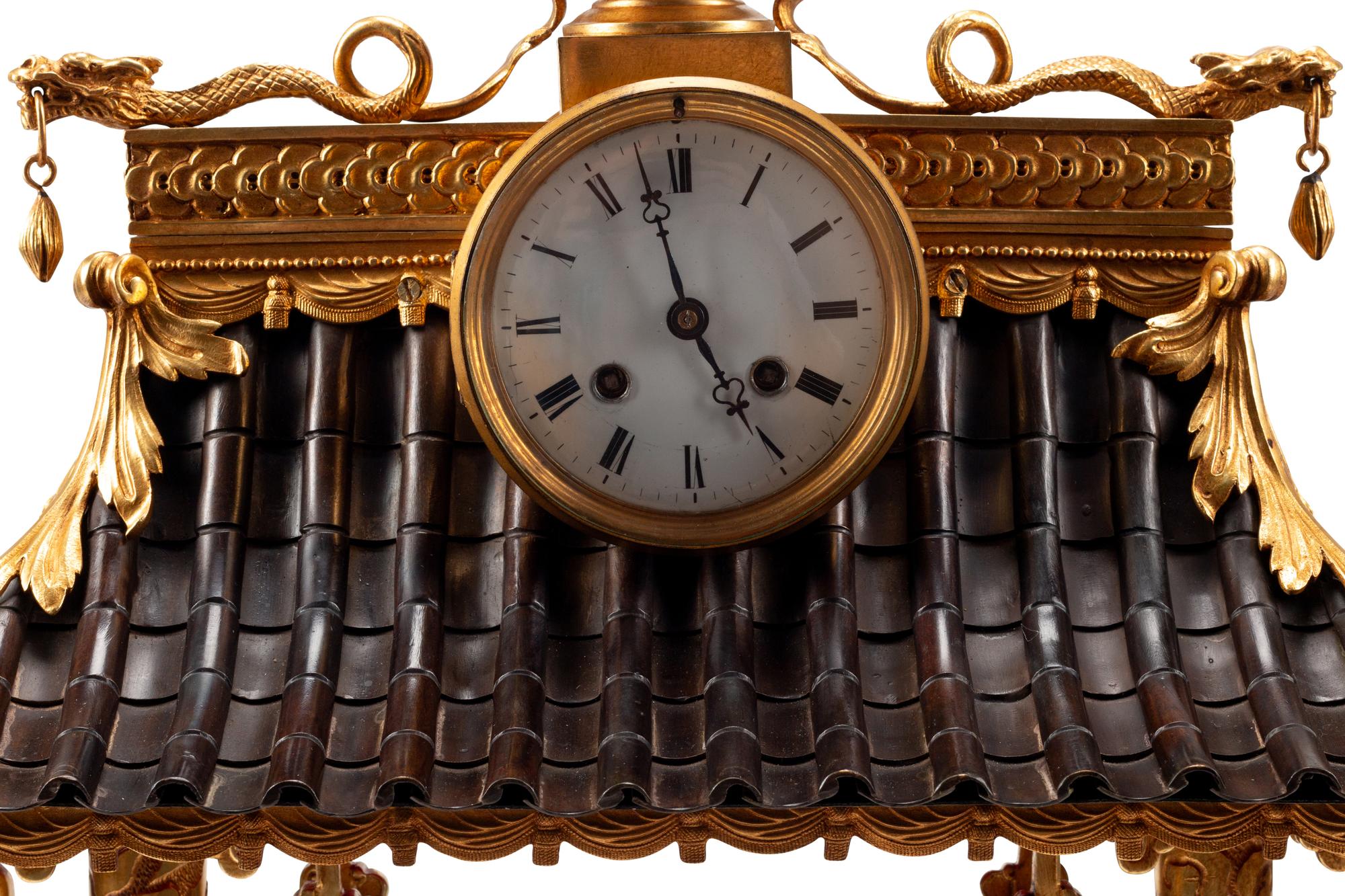 A Continental Gilt Bronze and Celadon Porcelain Figural Chinoiserie Clock