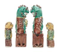 Two Pairs of Chinese Sancai Glazed Porcelain Figures of Fu Lions