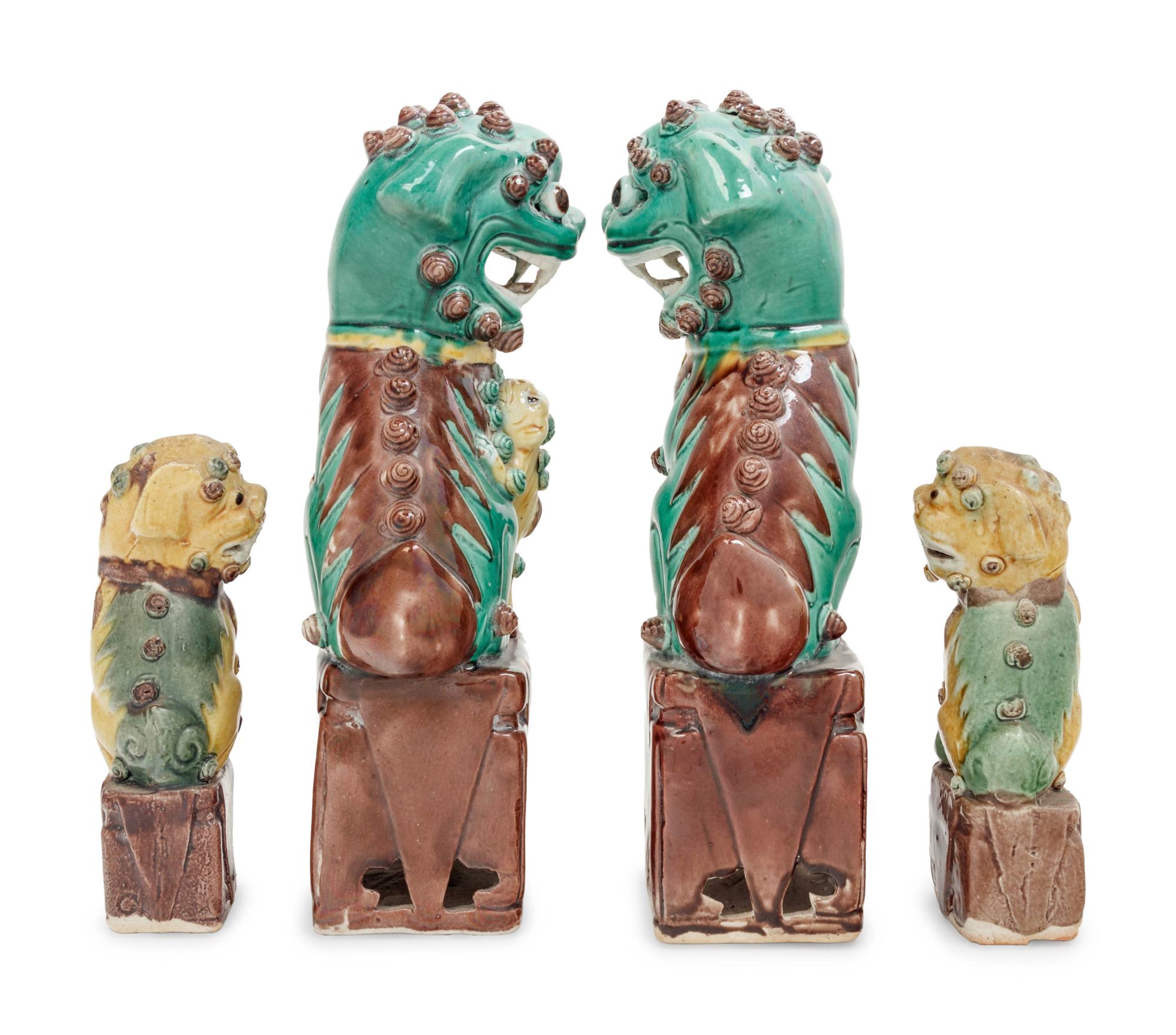 Two Pairs of Chinese Sancai Glazed Porcelain Figures of Fu Lions
