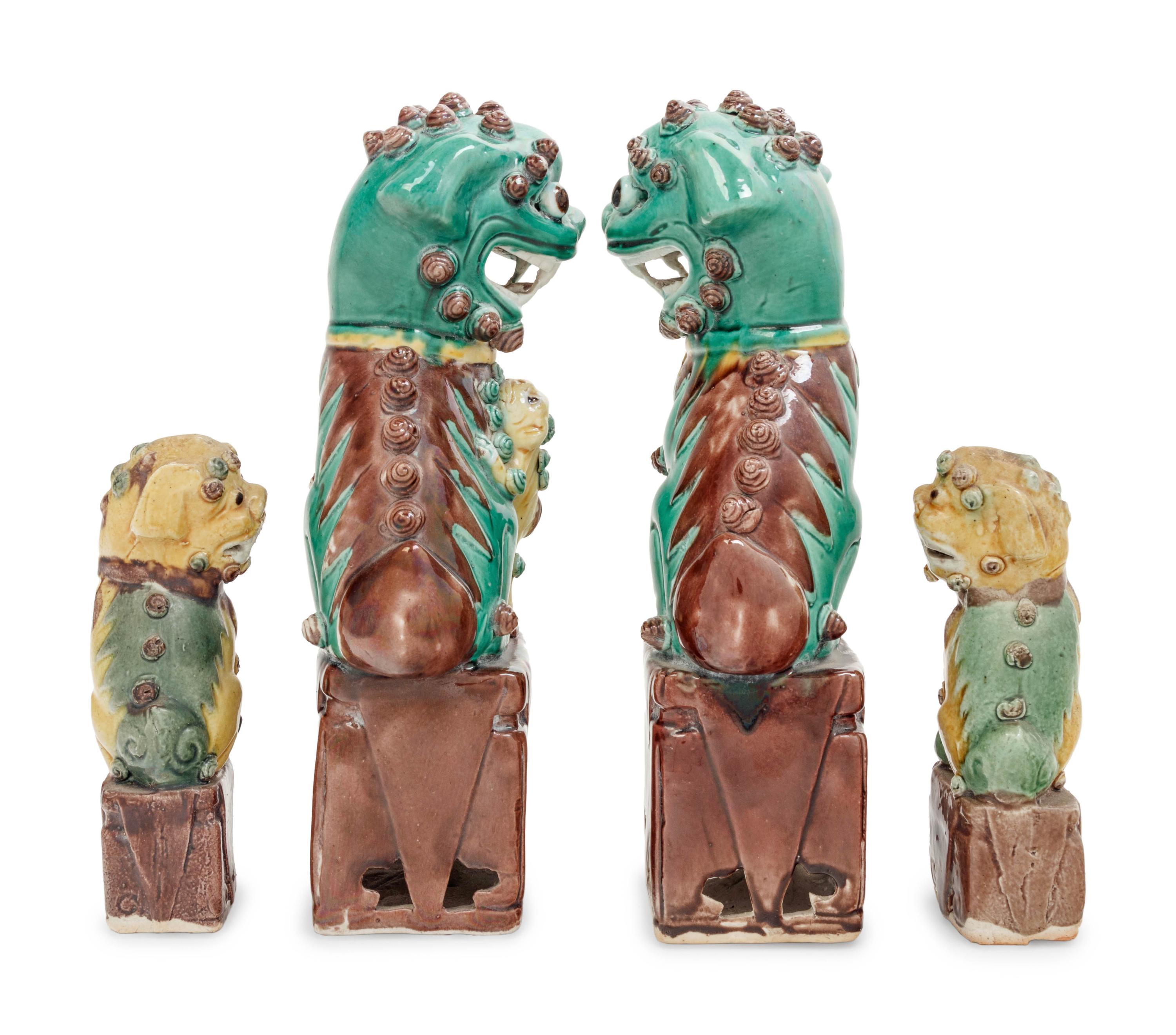 Two Pairs of Chinese Sancai Glazed Porcelain Figures of Fu Lions