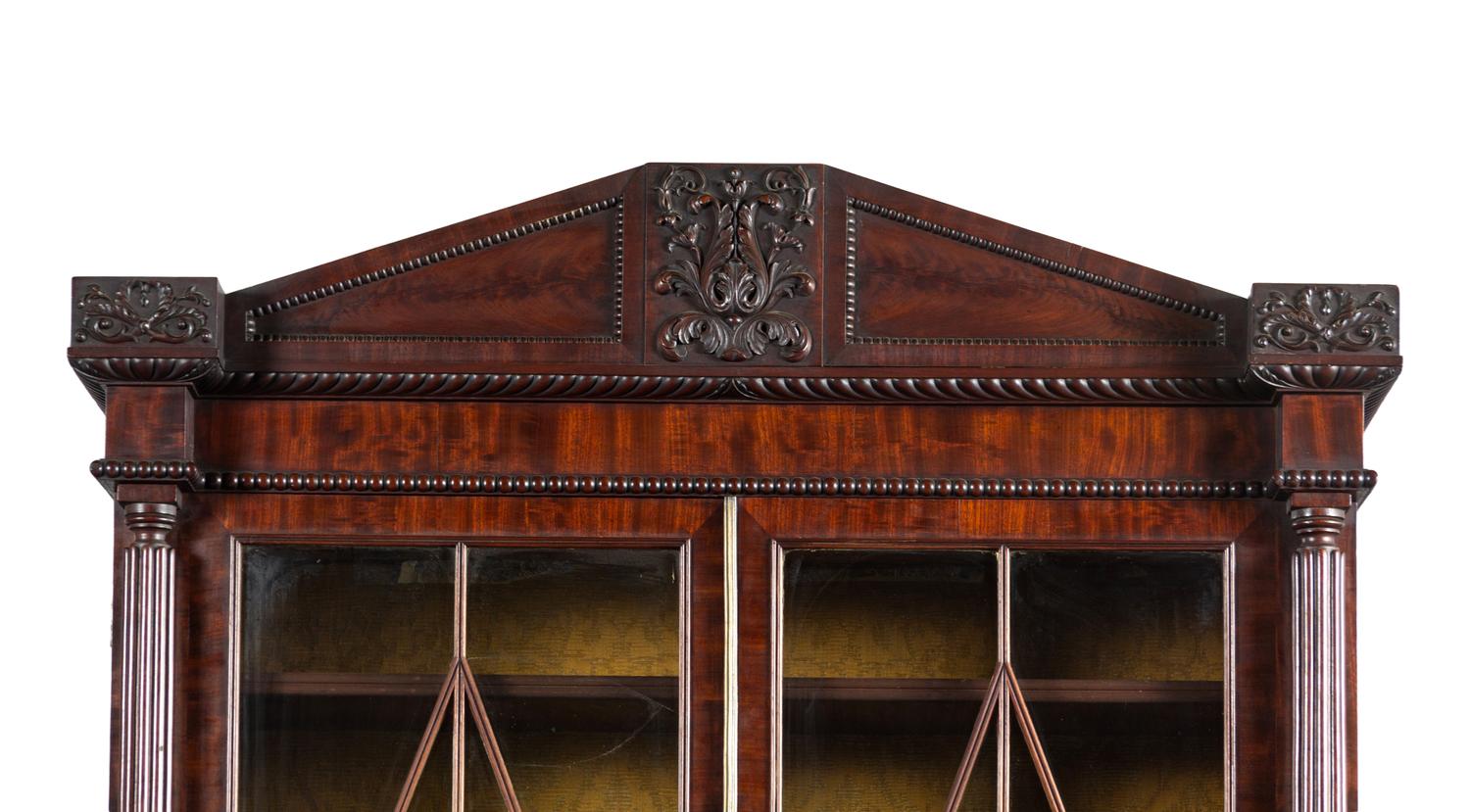 A Regency Carved and Figured Mahogany Secretary Bookcase