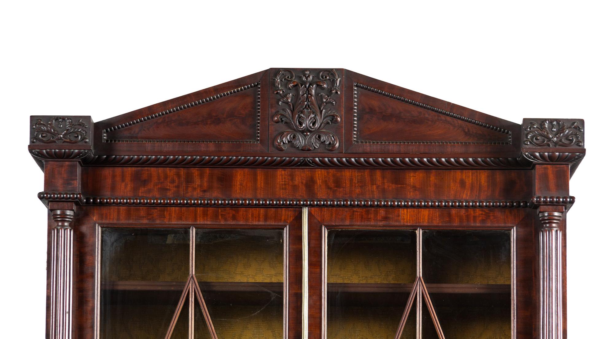 A Regency Carved and Figured Mahogany Secretary Bookcase