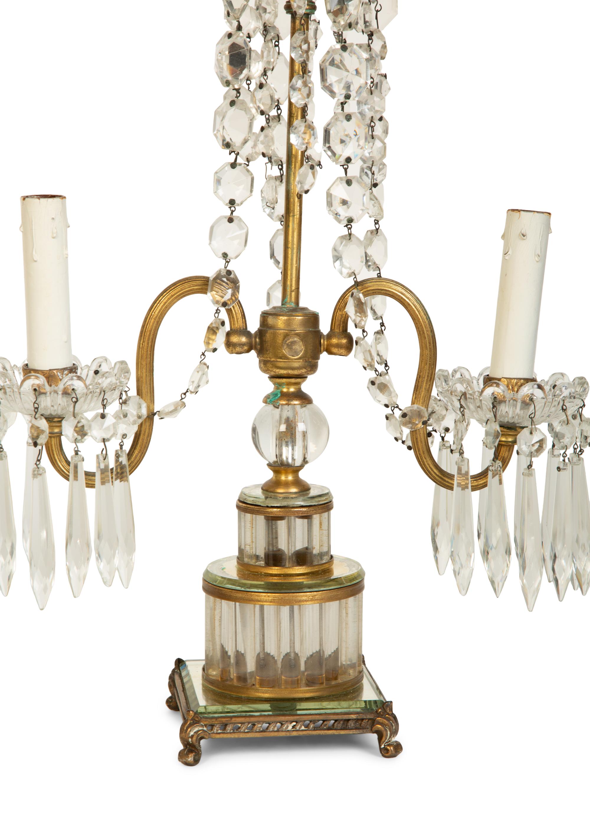 A Pair of Continental Gilt Metal and Glass Two-Light Candelabra
