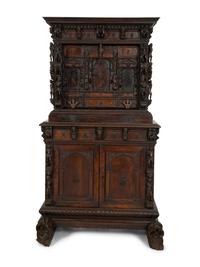 A Continental Baroque Walnut Cabinet