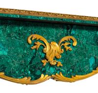A Louis XV Style Gilt Bronze Mounted Malachite Veneered Bureau Plat