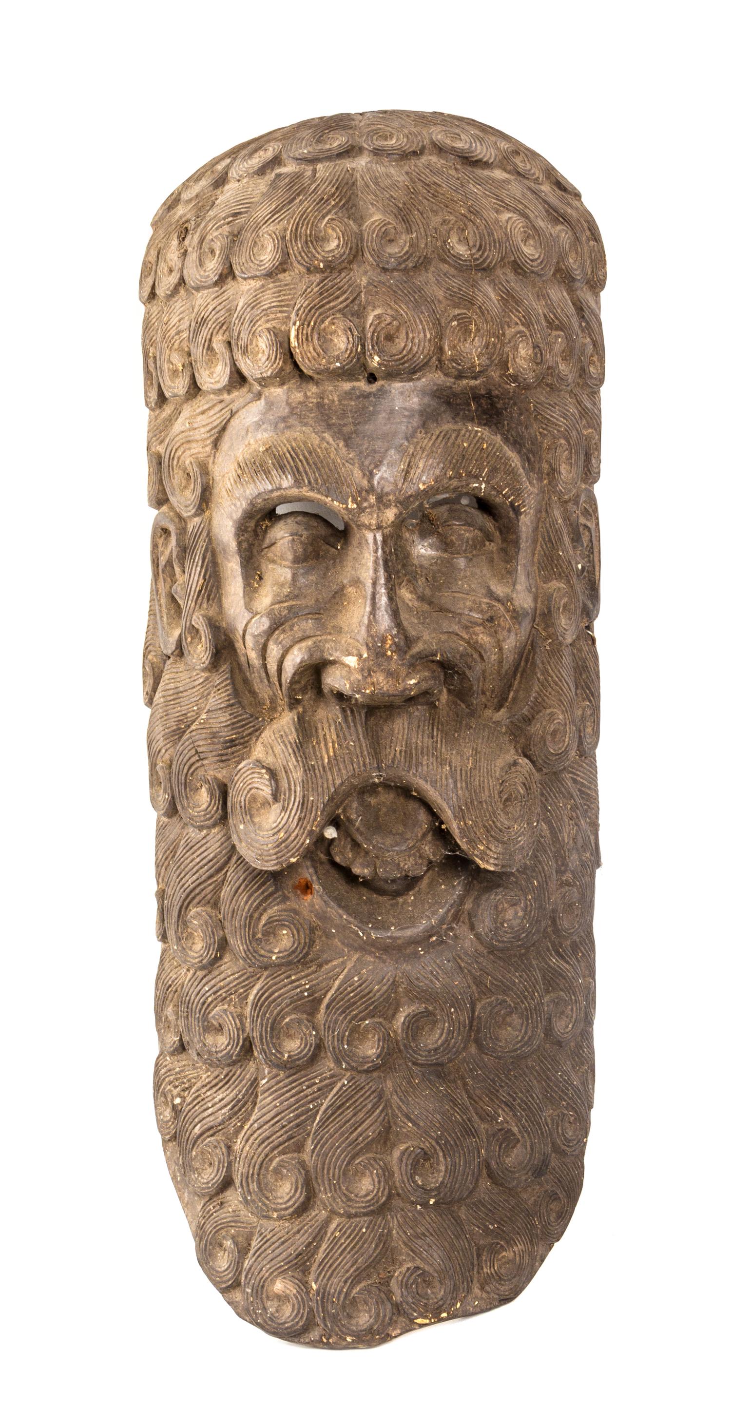 An Italian Carved Wood Mask, Height 25 1/2 inches.