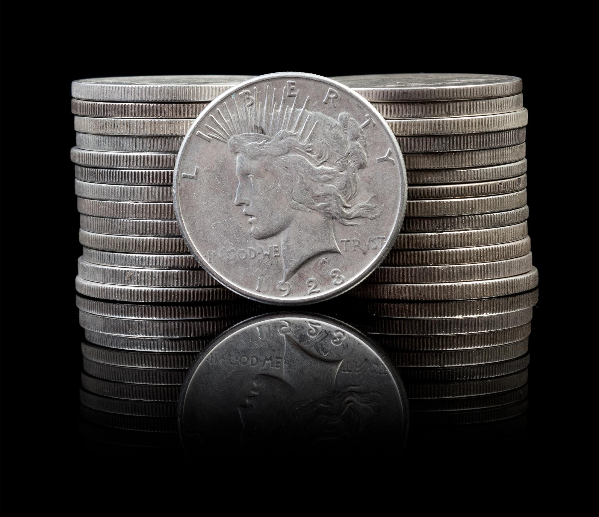 A Group of 27 United States Peace Silver Dollars