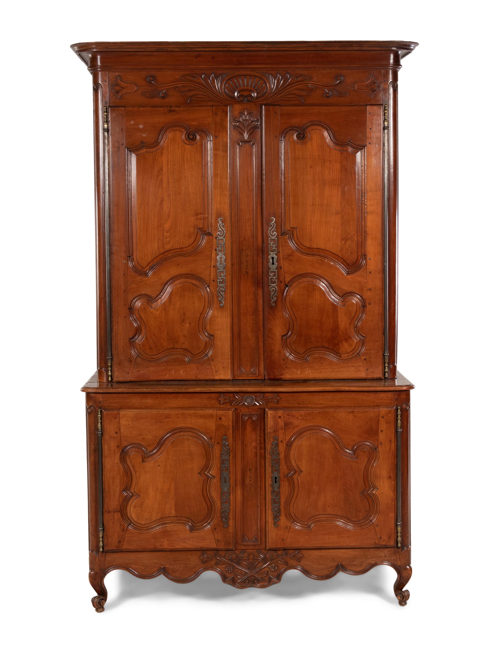 A Louis XV Provincial Cherry Stepback Cupboard