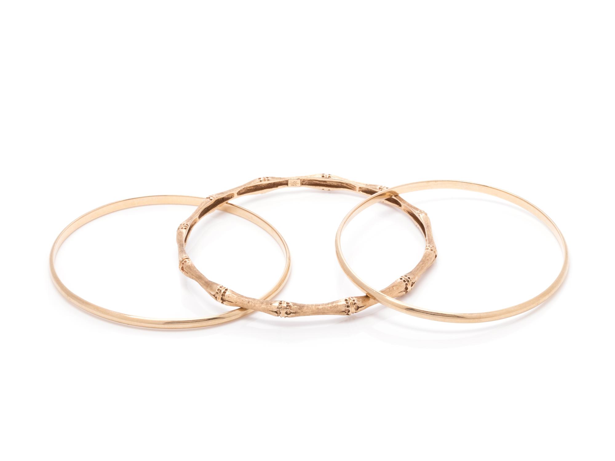 COLLECTION OF YELLOW GOLD BANGLE BRACELETS