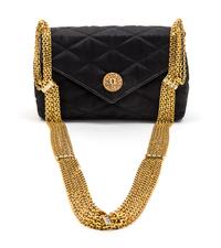 A Chanel Black Satin Quilted Convertible Evening Bag, 6 1/2 x 4 x 2 1/2 inches.